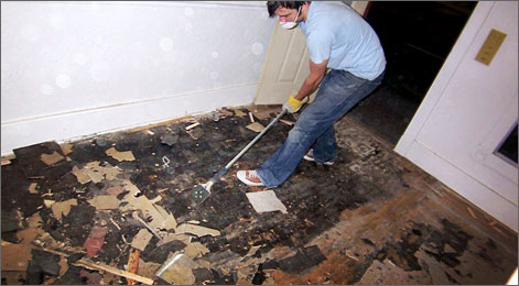 John Henry scraping tile off